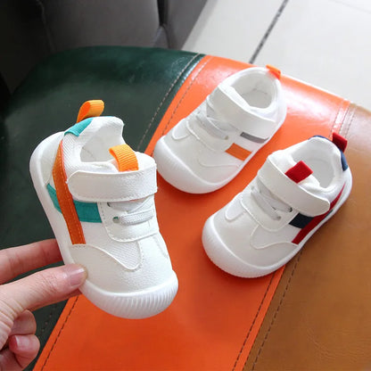 Toddler sneakers with soft sole, non-slip grip, and breathable materials for first walkers.