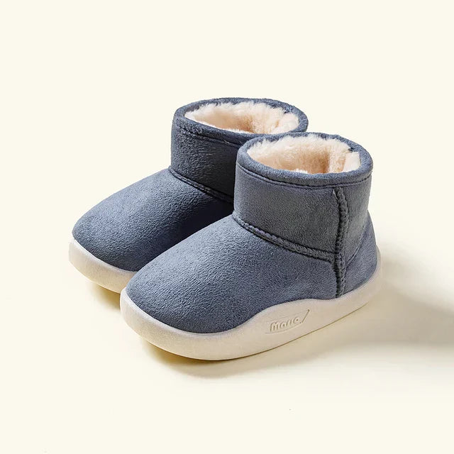 Close-up of suede kids' winter boots showing non-slip sole texture and durable stitching