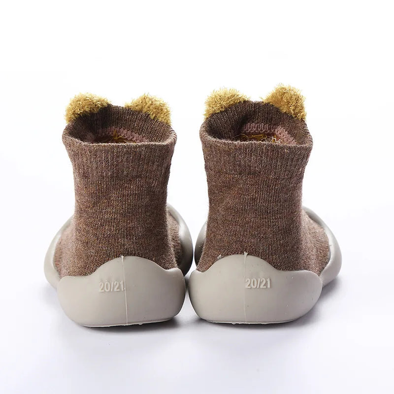 Indoor toddler walking shoes, anti-slip soft sole, blue knitted design for baby boys and girls.