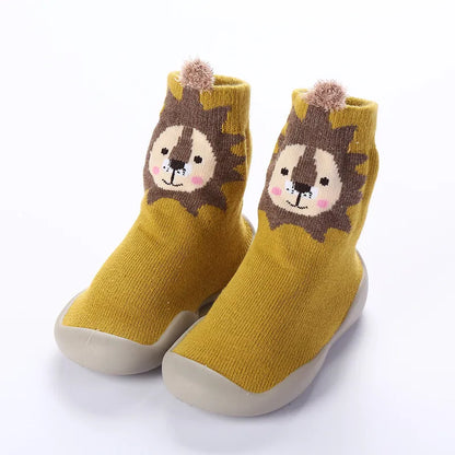 Green knitted soft sole anti-slip baby shoes, comfortable and secure footwear for early walkers.