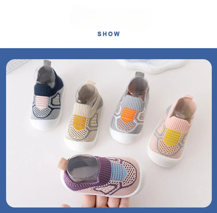 Soft sole baby shoes with elastic openings, ensuring a secure yet comfortable fit for tiny feet.