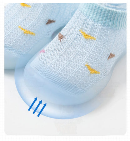 Grey toddler first steps shoes with a comfortable soft sole and non-slip bottom.