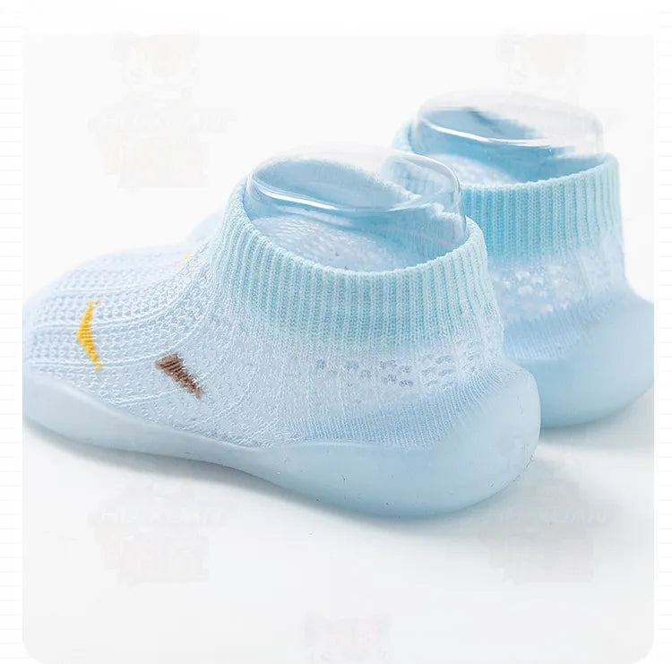 Pink non-slip baby walking shoes, flexible and lightweight for infant first steps, soft sole.