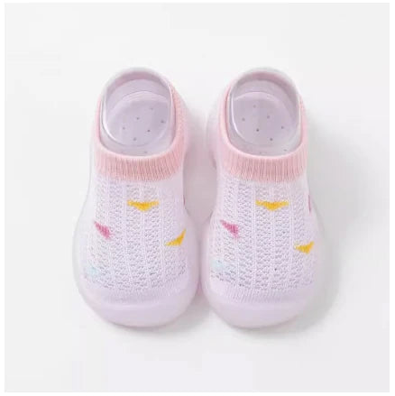 Toddler first steps shoes, light blue knit upper, flexible non-slip sole, infant footwear.