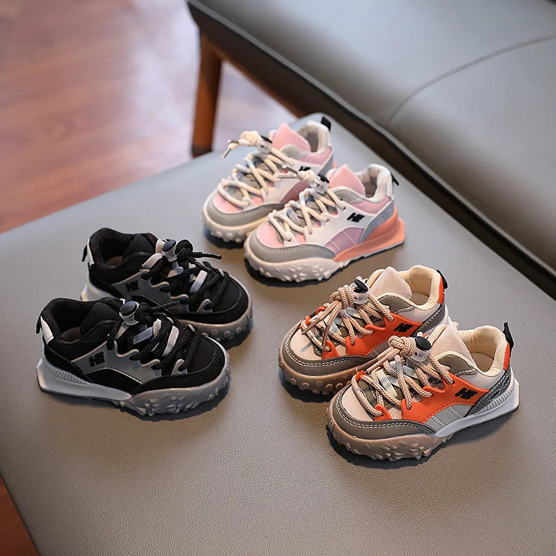 Side view of children's play shoes, showcasing the comfortable design and robust construction for active kids.