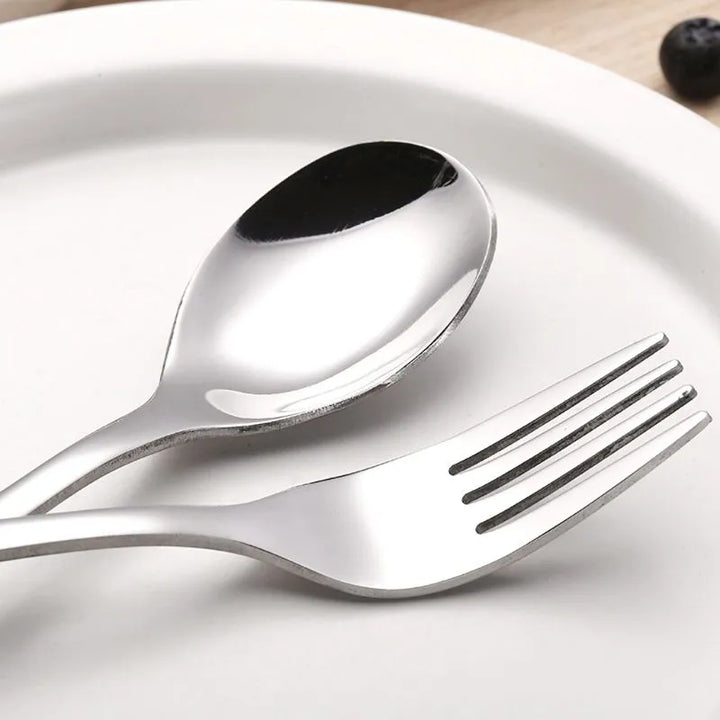 Robust 4-piece stainless steel utensil set for toddlers, essential for feeding development.