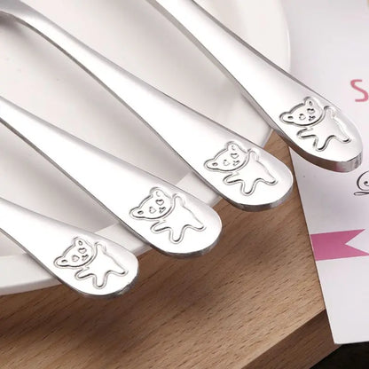 Child-friendly stainless steel cutlery set, 4 pieces, designed for toddler self-feeding.