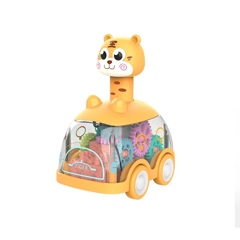 Happy toddler pushing a transparent inertia toy car, enhancing hand-eye coordination & gross motor skills