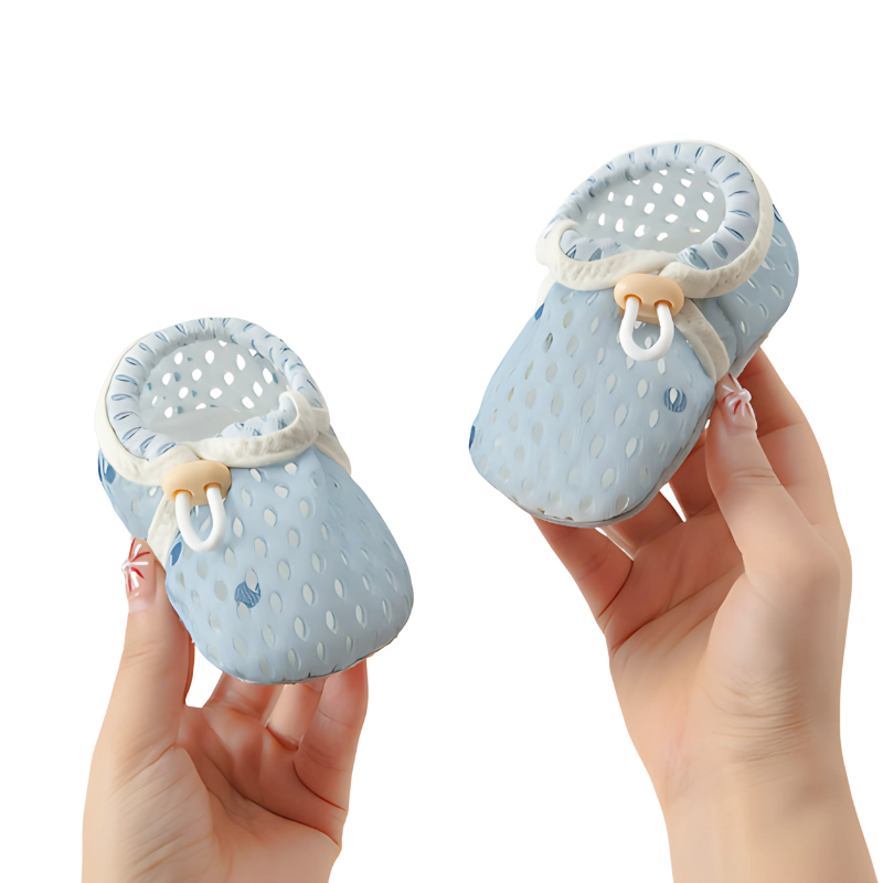 Close-up of flexible sole on green toddler summer shoes, designed for infant comfort