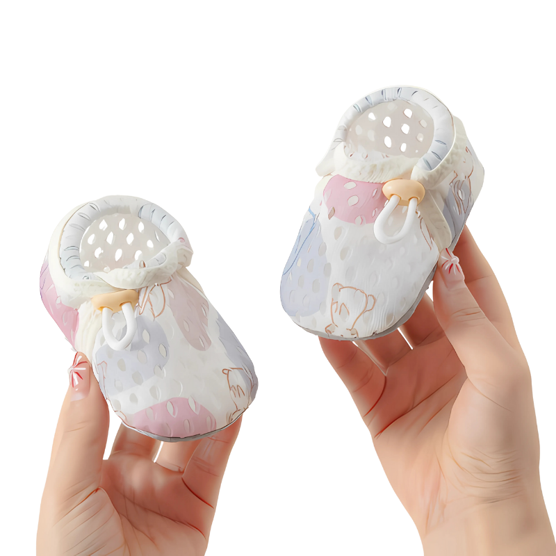 Breathable mesh detail on a white toddler summer shoe, ensuring infant comfort