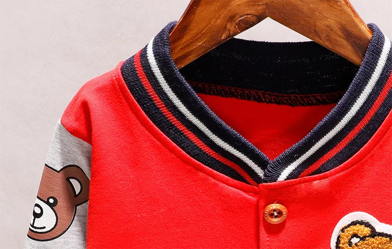 Back view of a blue toddler cotton jacket featuring a playful cartoon design, comfy outerwear