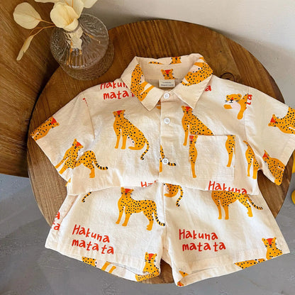 Children's short sleeve cotton outfit, featuring a unique cartoon print, great for summer fun