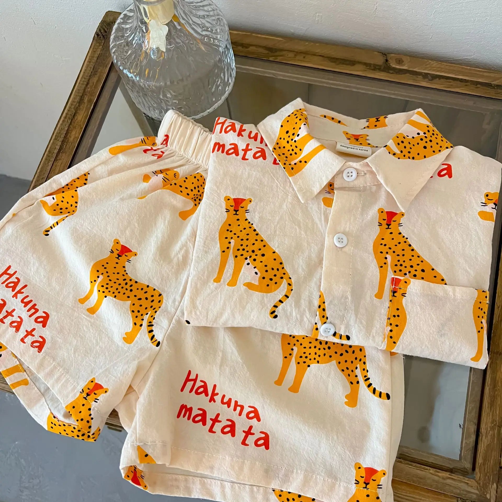 Kids' comfortable short sleeve cotton summer outfit, featuring a fun and vibrant cartoon print