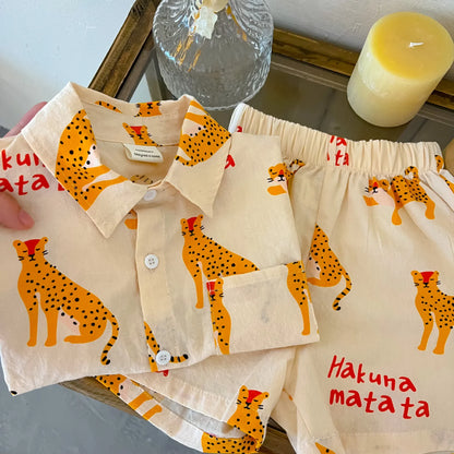 Unisex kids short sleeve top and pant set with a cheerful cartoon pattern, summer fashion