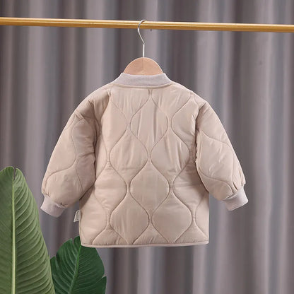 Cute toddler in a V-neck winter jacket, demonstrating comfort and warmth, baby essentials