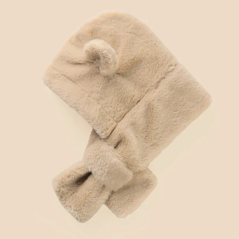 Close-up of a cozy toddler faux fur bear hat with earflaps and an integrated scarf, keeping baby warm