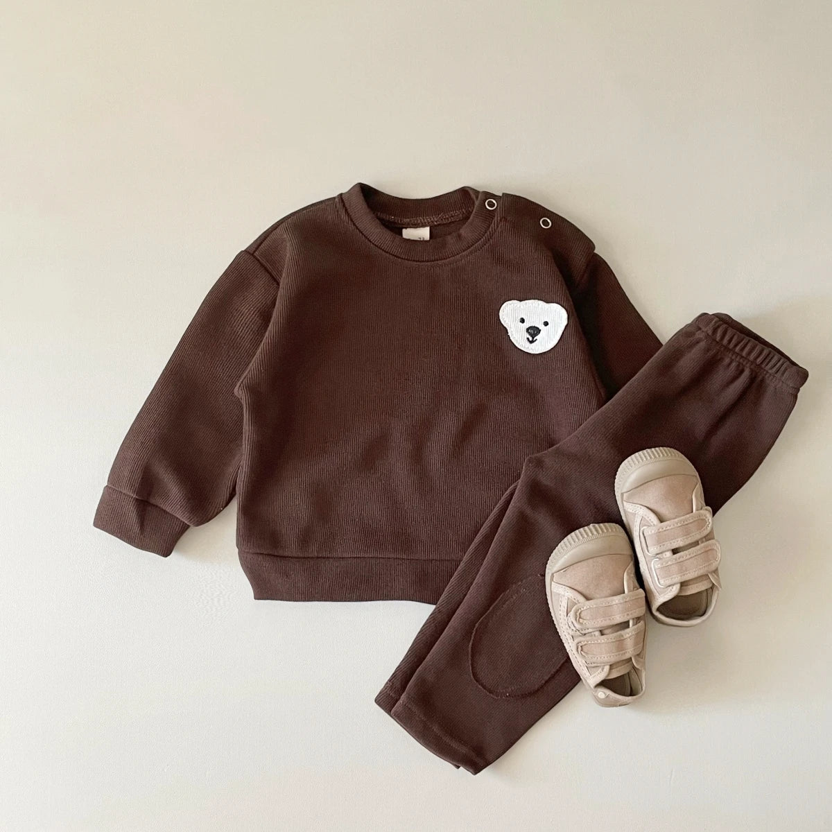 Unisex baby cotton tracksuit featuring cute bear & goose design, soft and comfortable.