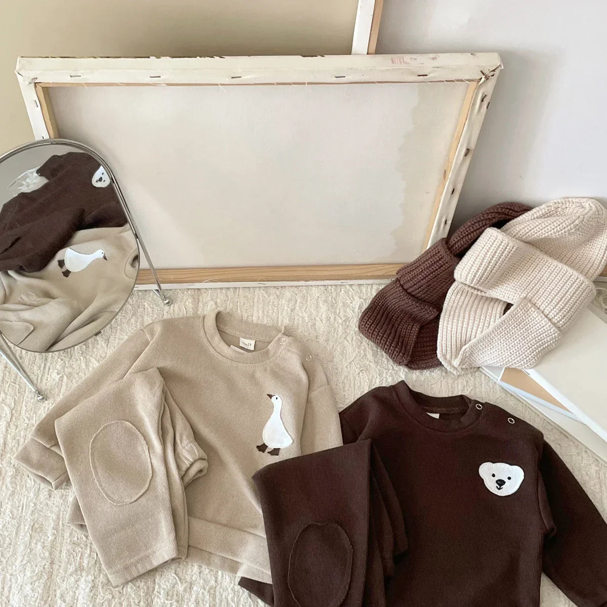 Easy care cotton tracksuit for toddlers, depicting a charming bear and goose pattern.