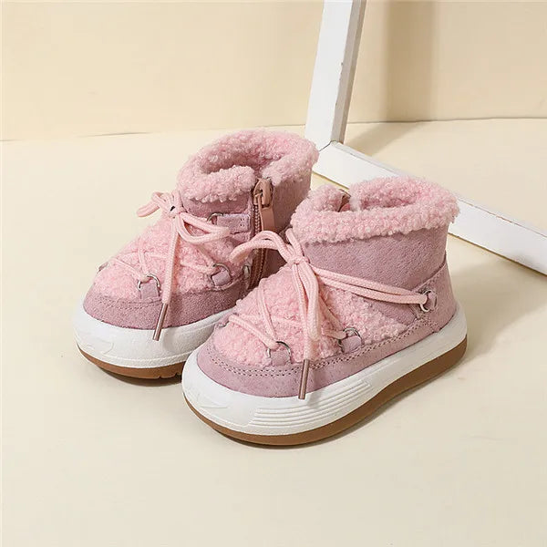 Faux fur interior of kids' winter boots, showcasing warmth and comfort, non-slip soles