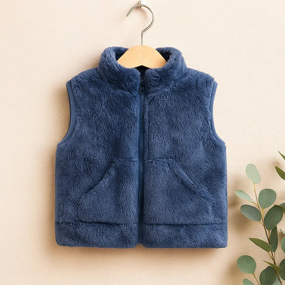 Toddler wearing red reversible fleece vest, warm infant outerwear, stylish kids vest