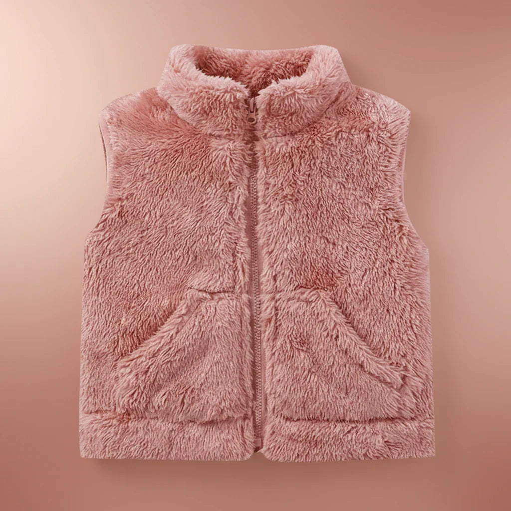 Warm fleece vest on a hanger, stylish reversible kids outerwear, comfortable children's clothing