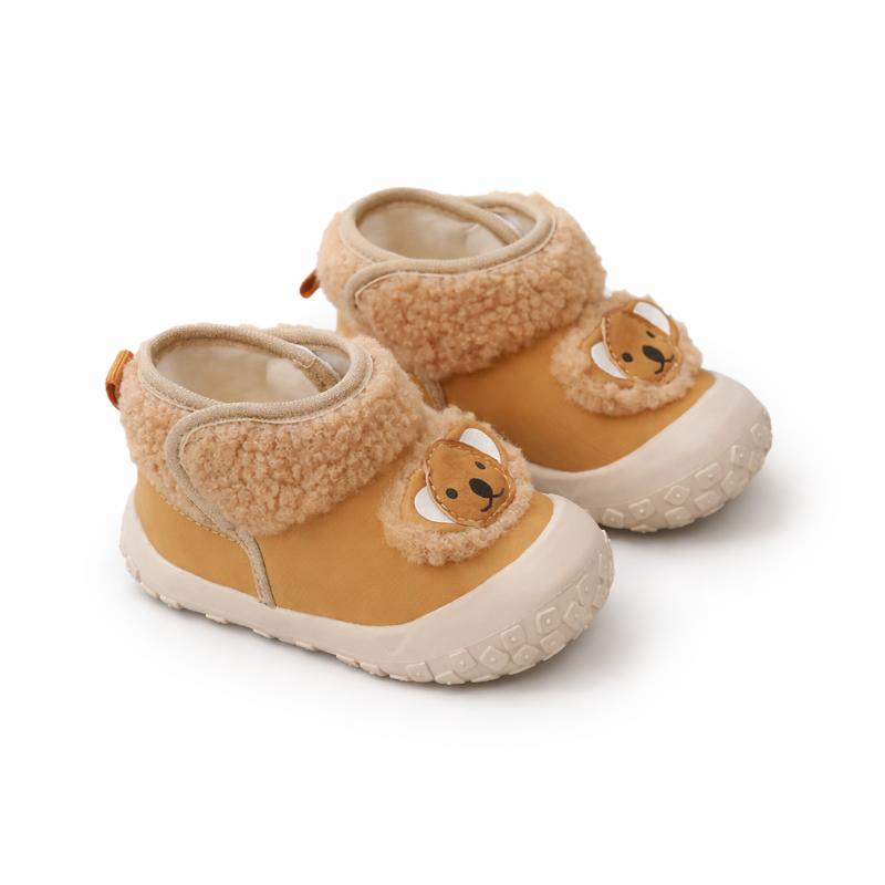 Close-up of animal print toddler winter boots, soft sole, warm lining, baby footwear