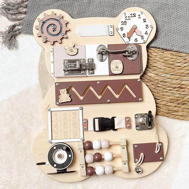Close-up of a toddler busy board showing intricate sensory activities for young children