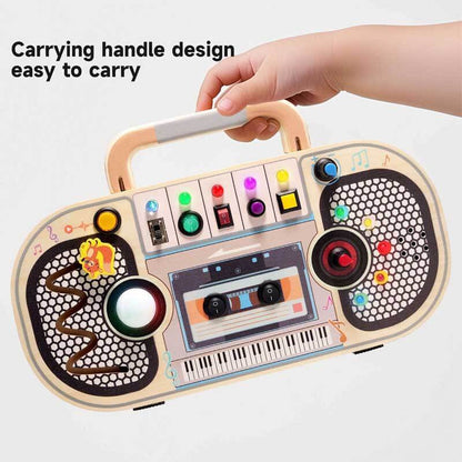 Child's hand playing with a natural wood recorder toy, enhancing sensory and fine motor skills.