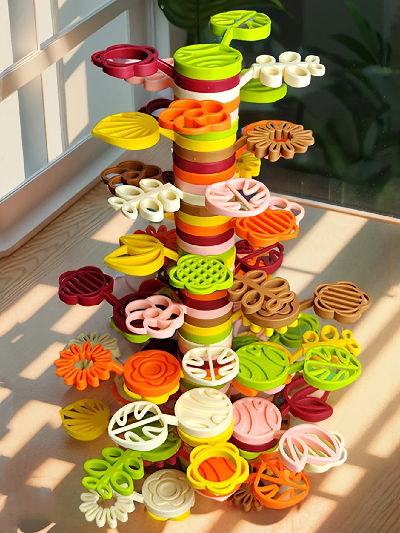 Close-up of wooden rainbow stacking tree blocks, designed as a STEM learning and balancing game for preschoolers.