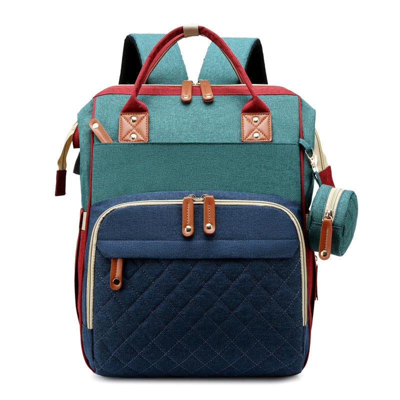 Travel diaper bag unfolds into a portable baby bed, ideal for on-the-go parents & infants.