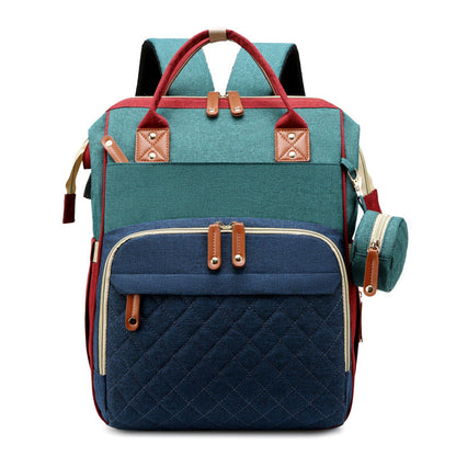 Travel diaper bag unfolds into a portable baby bed, ideal for on-the-go parents & infants.