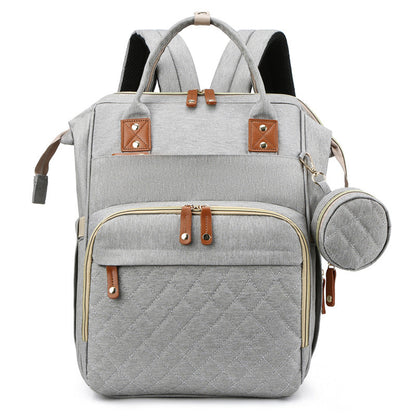 Innovative travel diaper bag that serves as a portable crib, perfect for travel & everyday use.