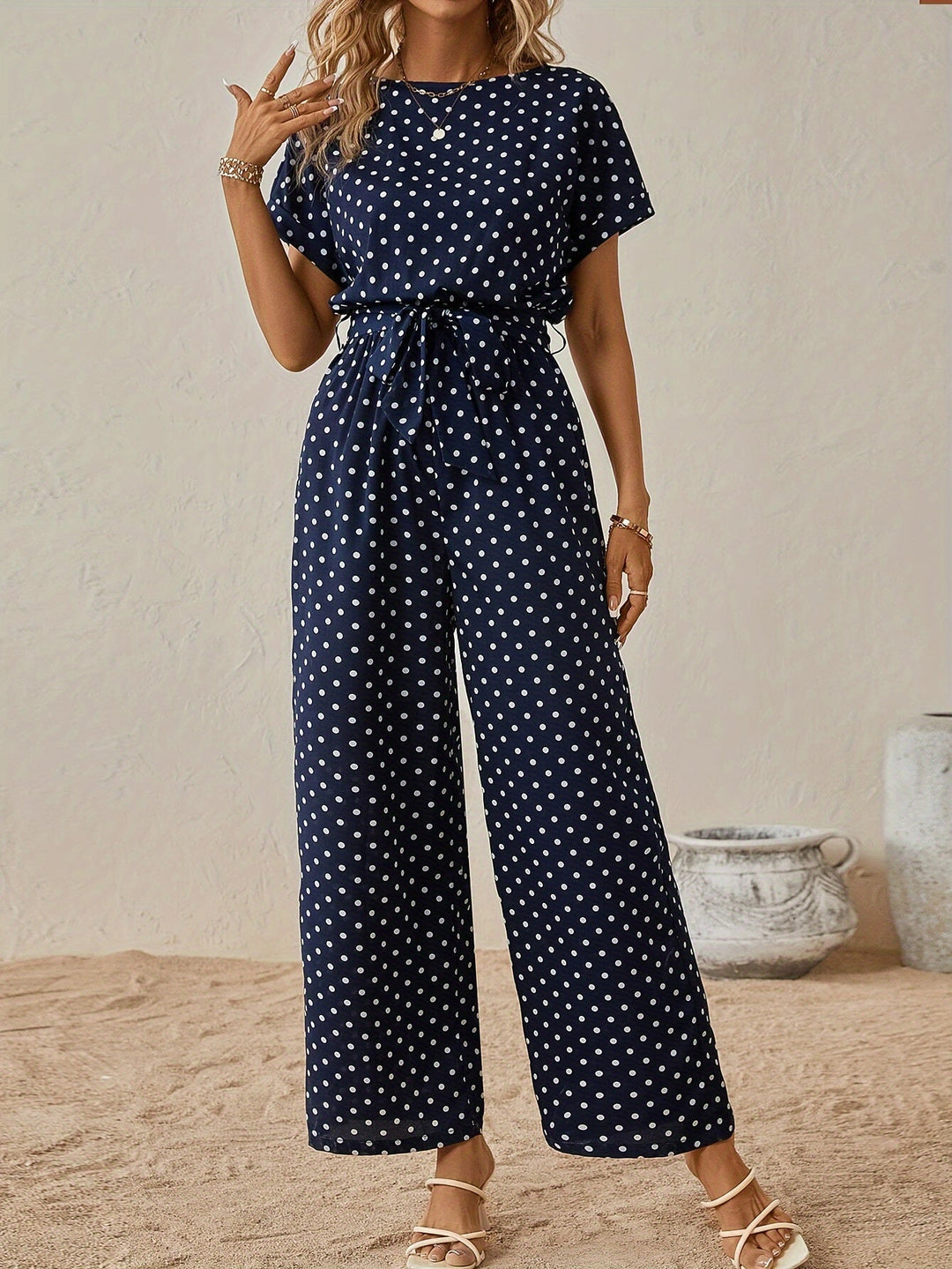 Trendy women's polka dot jumpsuit with waistband, perfect for summer casual wear & vacations.