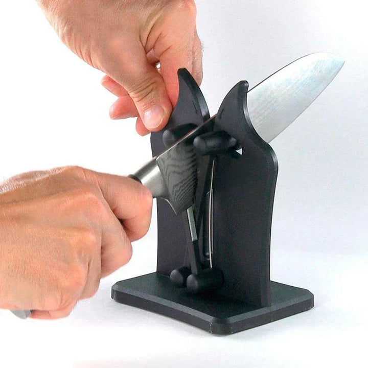 Sleek stainless steel kitchen knife sharpener. Triple-action design ensures professional, precise blade sharpening for all knives.