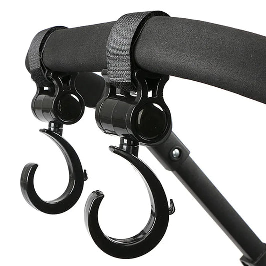 Two black multi-purpose stroller hooks for hanging diaper bags, groceries & more, hands-free.