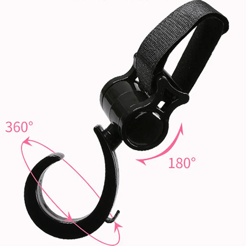Close-up of a black multi-purpose stroller hook securely attached to a stroller handle.