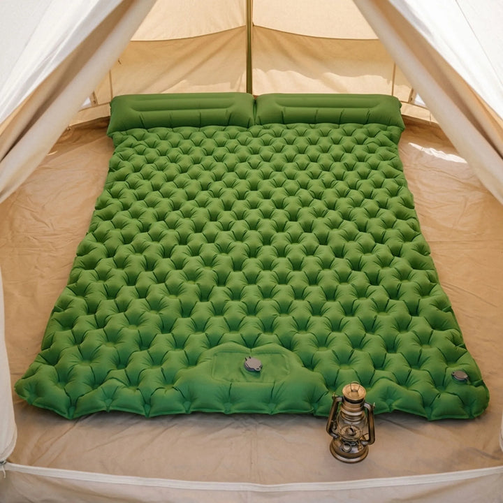 Two-person portable camping air mattress, ideal for comfortable outdoor adventures & double sleeping.