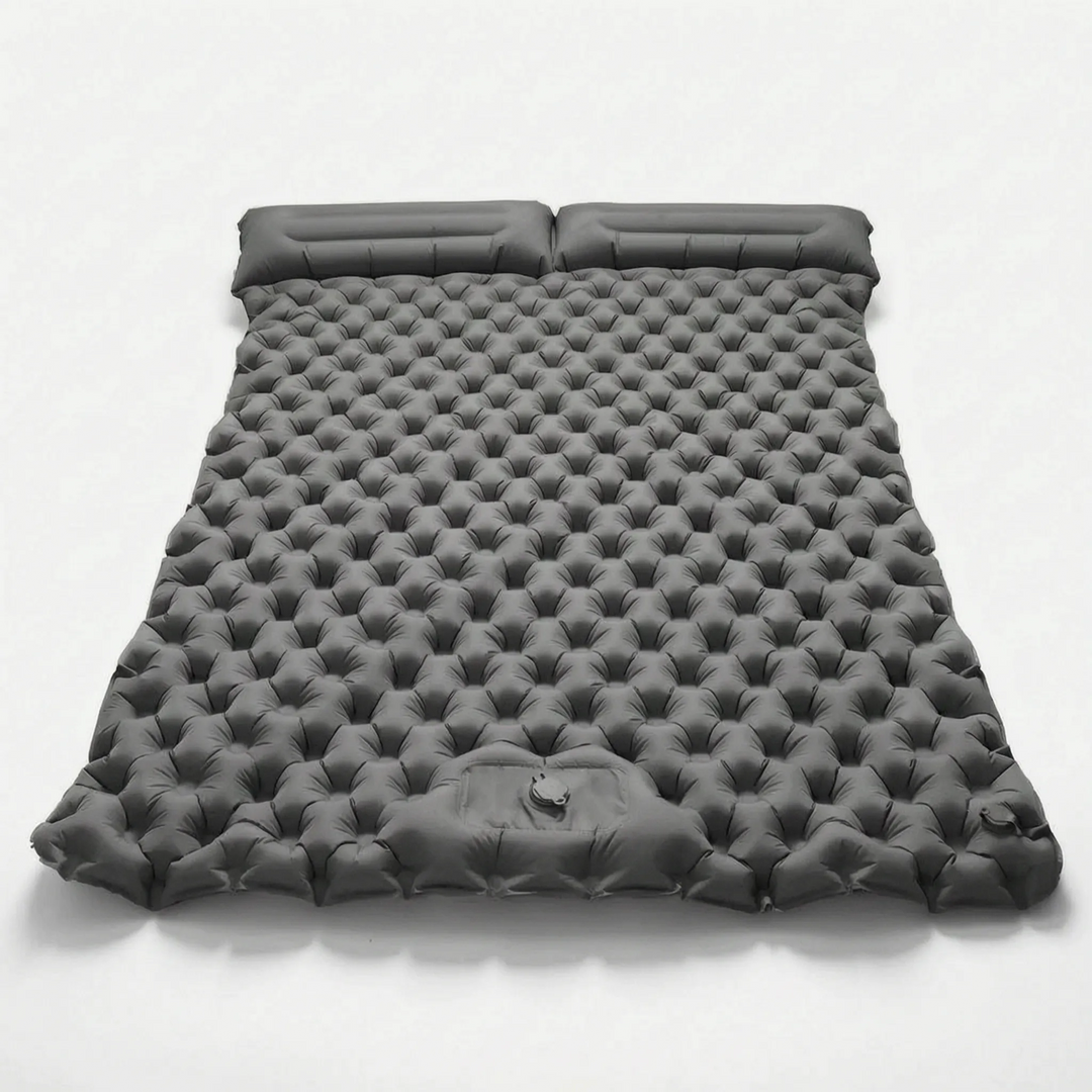 Portable two-person sleeping pad, perfect air mattress for outdoor camping, hiking, and adventure recreation.