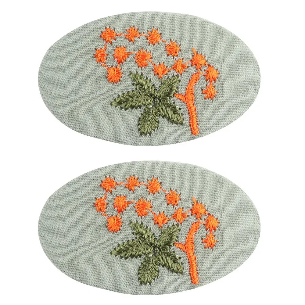 Retro floral hair clips for girls, featuring a cute design and secure clasp