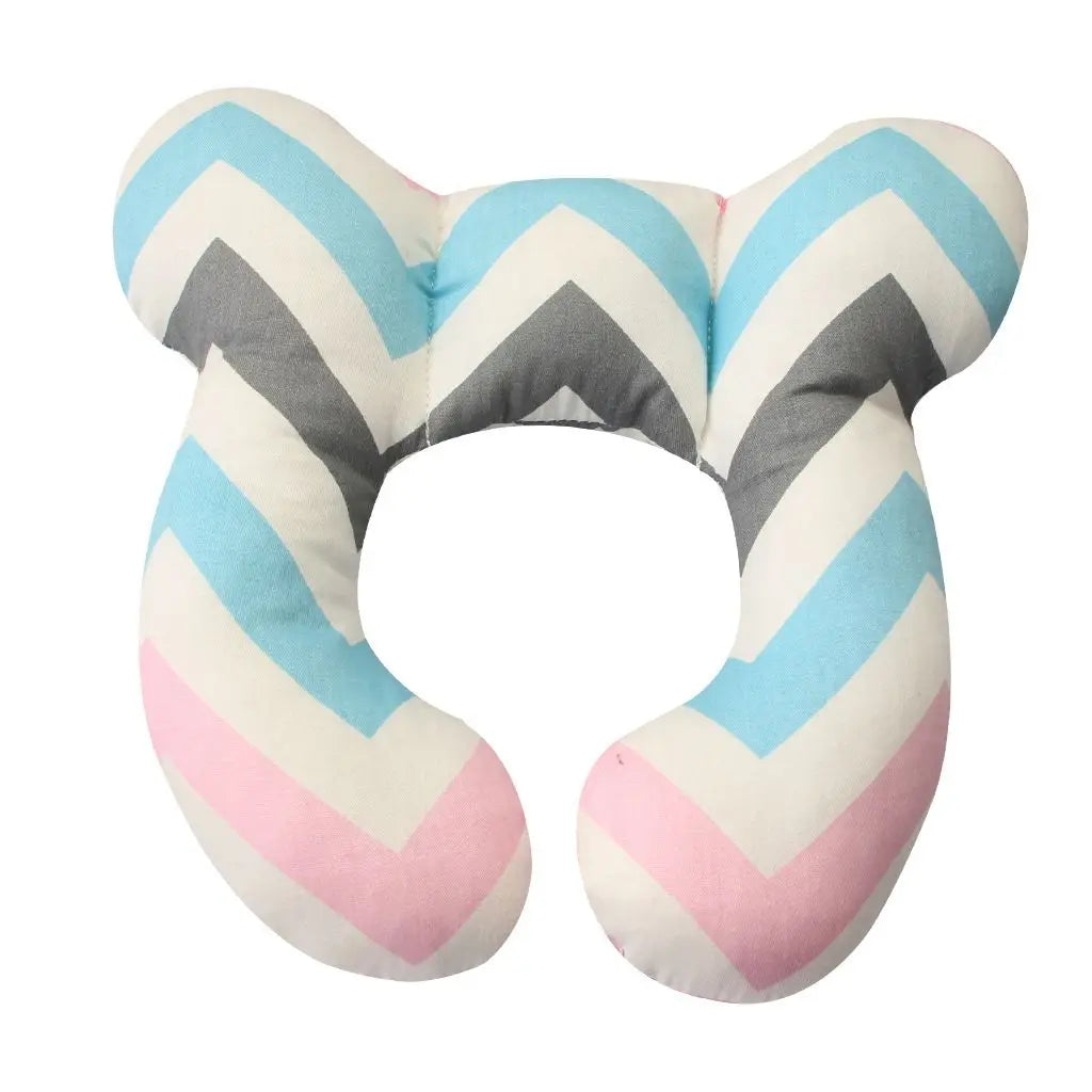Side view of a U-shaped baby head and neck support pillow, highlighting its ergonomic shape for secure car seat use