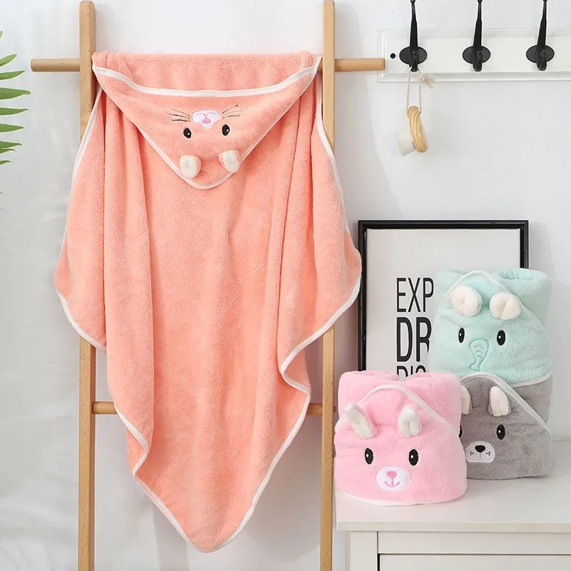 Gentle coral fleece baby towel with hood, perfect for drying baby's hair and body.