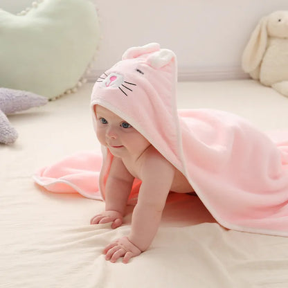 Plush coral fleece baby blanket with hood, ideal for wrapping toddlers after a bath.