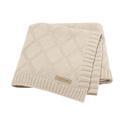 Unisex cotton swaddle blanket with a minimalist deer print, perfect for modern nursery decor