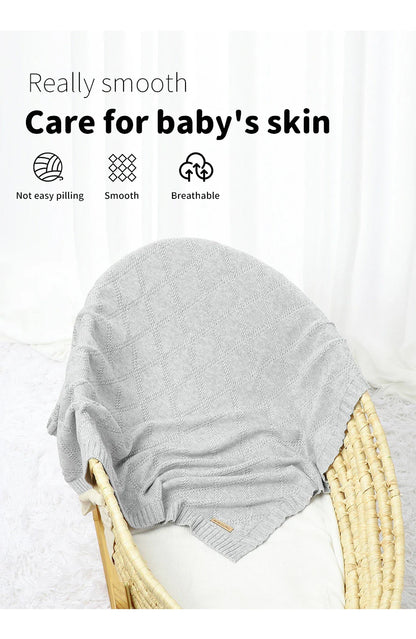 White cotton baby blanket with an adorable cloud pattern, an ideal gift for a baby shower