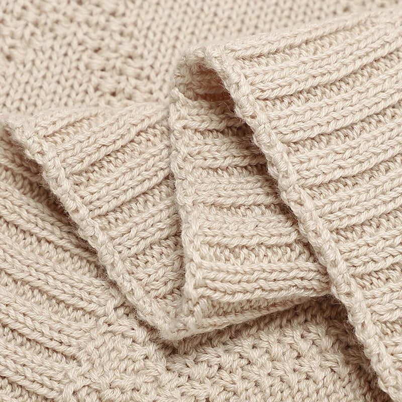 Set of three gender-neutral cotton baby swaddles in various patterns, essential for new parents