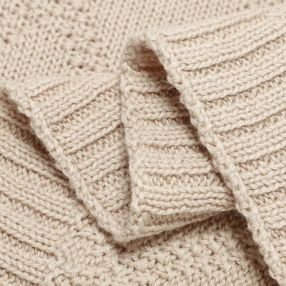 Set of three gender-neutral cotton baby swaddles in various patterns, essential for new parents