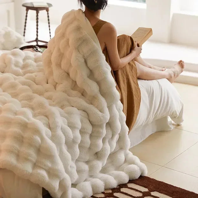 Luxurious, ultra-soft faux fur throw blanket. Cozy beige & white design for ultimate comfort & warmth.