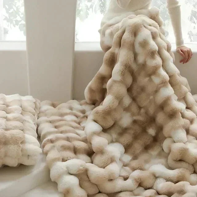 Plush faux fur cuddle throw in beige/white. Ultra soft, warm, & cozy, a luxury addition to any living room.