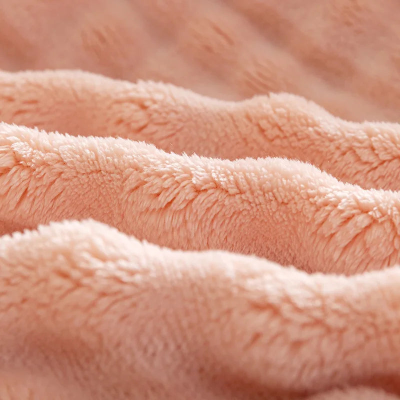 Luxurious, warm flannel throw blanket draped elegantly over a bed, enhancing home textiles with plush comfort.