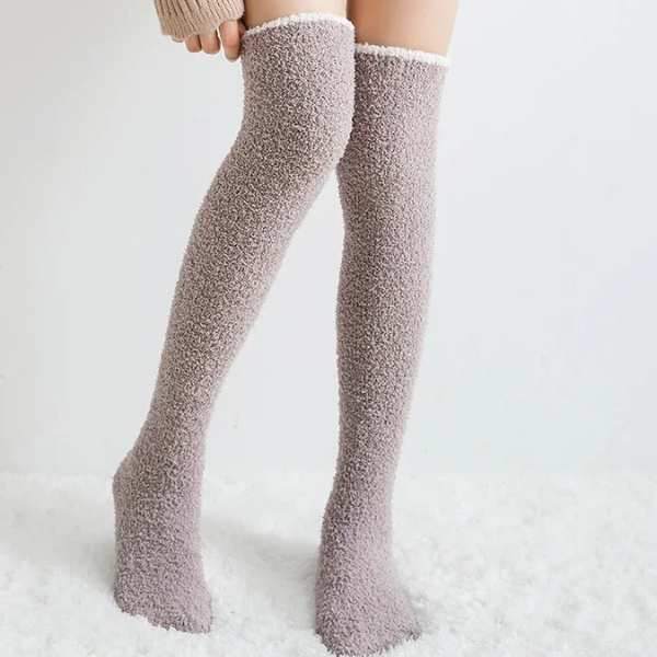 Ultra-soft women's fuzzy knee high socks, providing luxurious warmth and cozy comfort for relaxation at home.